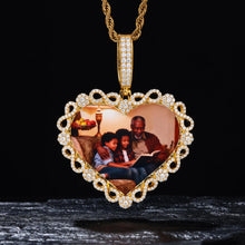 Load image into Gallery viewer, 14k yellow gold custom iced out heart necklace resting on a dark stone, featuring a personalized family memory picture.