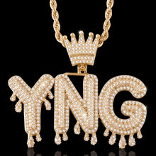 Load image into Gallery viewer, Gold drip name chain with iced out YNG bubble letters and a crown on a black background