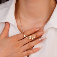Load image into Gallery viewer, Woman wearing a gold custom butterfly script name necklace, hand resting on her chest