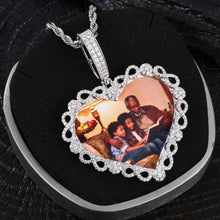 Load image into Gallery viewer, The white gold custom iced out heart necklace elegantly displayed inside a dark gift box on a rope chain.