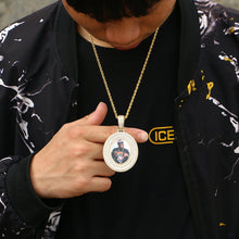 Load image into Gallery viewer, Man wearing a custom oval picture necklace, showing the pendant's real size on the chest