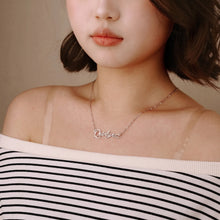 Load image into Gallery viewer, Gold script name necklace worn at the collarbone