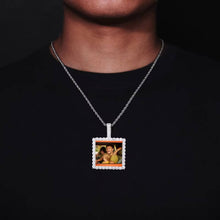 Load image into Gallery viewer, A model wearing the white gold plated iced-out custom square picture necklace for men on a rope chain.