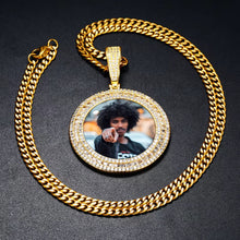 Load image into Gallery viewer, Iced out yellow gold custom picture pendant for men attached to a matching cuban link chain against a black background.