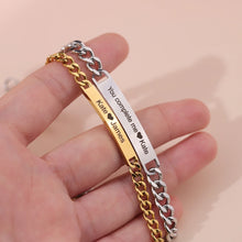 Load image into Gallery viewer, Gold and silver custom engraved couple bar bracelets held in a hand