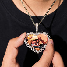 Load image into Gallery viewer, Heart photo pendant held in hand to show size