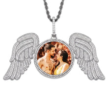 Load image into Gallery viewer, Silver personalized angel wing necklace with a couple's photo in a double CZ halo, on a silver rope chain, white background
