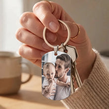 Load image into Gallery viewer, Woman holding a picture dog tag keychain with a color photo of a dad and baby