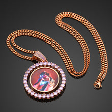 Load image into Gallery viewer, Rose gold plated colorful custom double-sided rotating pendant with purple zircon stones on a matching chain against a dark background.