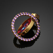 Load image into Gallery viewer, Close-up showing the spinning mechanism of the colorful cubic zirconia double-sided custom photo pendant, allowing for two personalized pictures to be displayed.