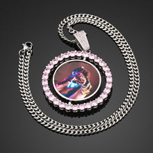 Load image into Gallery viewer, Silver GetEngravings colorful custom double-sided rotating pendant with iced-out pink zircon stones attached to a matching cuban link chain.