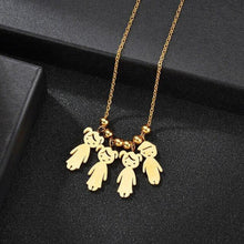 Load image into Gallery viewer, Close up of engraved child name charm on gold tone necklace