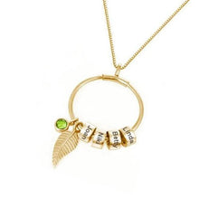 Load image into Gallery viewer, Gold plated circle pendant necklace with 4 engraved kids name beads and green birthstone