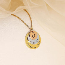 Load image into Gallery viewer, Layered gold rose gold and silver disc pendant with engraved baby footprints close up