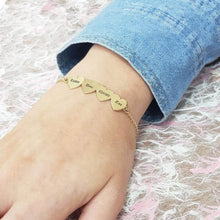 Load image into Gallery viewer, Personalized heart charm name bracelet worn on a woman's wrist