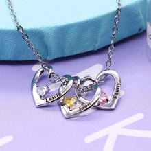 Load image into Gallery viewer, Personalized heart necklace with multiple engraved names on jewelry stand