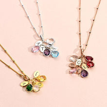 Load image into Gallery viewer, Personalized initial birthstone necklace for mom styled on a soft pink background as a gift