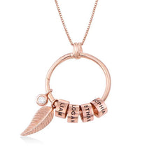 Load image into Gallery viewer, Rose gold circle pendant necklace featuring custom engraved name beads and a delicate leaf charm