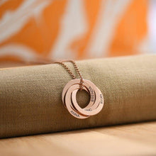 Load image into Gallery viewer, Rose gold plated personalized name necklace with engraved family names close up