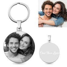 Load image into Gallery viewer, Round photo keychain with a couple's photo engraved in black and white, shown next to the original photo