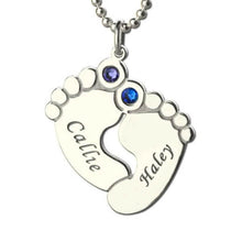 Load image into Gallery viewer, Silver color baby feet necklace with two engraved names and colored birthstones