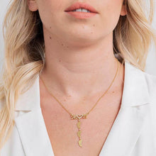 Load image into Gallery viewer, Woman wearing custom baby feet name necklace with white shirt
