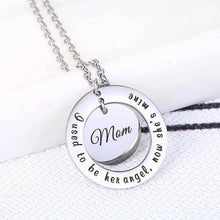 Load image into Gallery viewer, Side angle of the layered pendant showing the raised outer ring and 1.5mm thickness