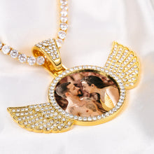 Load image into Gallery viewer, Gold picture chain with wings on a CZ tennis chain, close-up of the iced-out wings